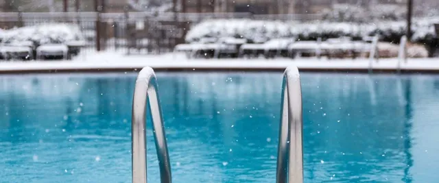 Side of swimming pool ladder frozen